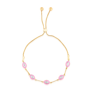 Gold bracelet with pink and clear gemstones on a white background | Adila Jewels
