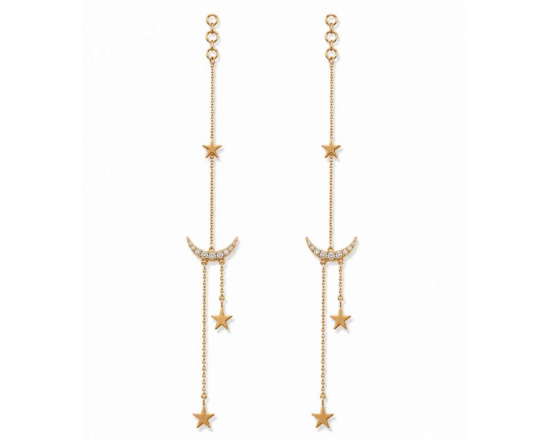 A pair of gold dangle earrings featuring a crescent moon and star motifs, with small clear rhinestone accents on the crescent moons and circular gold posts at the top, shown against a plain white background.