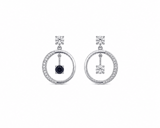 A pair of silver-tone dangle earrings with circular openwork borders, small pavé-set stones, and a central dark round gemstone in each earring, shown on a plain white background.
