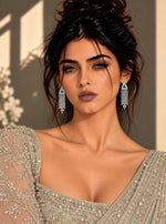 Panna Jhilmil Earrings: silver-plated fringe earrings with American diamond strands and a green stone
