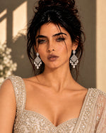 Darbar Chandelier Earrings: silver-plated chandelier earrings with American diamond stones and pearl-look drops