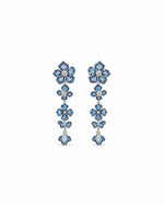 Neelaya Cascade Earrings: silver-tone brass floral drop earrings with American diamonds and blue stones