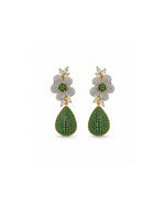 A pair of gold and diamond drop earrings featuring a floral cluster with green emerald centers and teardrop-shaped green pavé drops, shown on a plain white background.