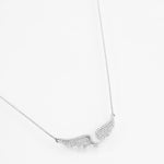 Silver moissanite pendant shaped like angel wings