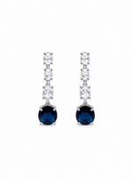 A pair of silver drop earrings featuring a vertical chain of clear marquise-cut stones ending in a round deep blue gemstone, shown on a plain white background.