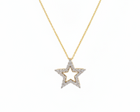 Star-shaped pendant necklace on a gold chain against a white background