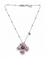 Rubaani Blossom Pendant Set: silver-tone brass flower pendant necklace with American diamonds and red stones