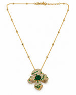 Vanya Blossom Pendant Set: gold-tone brass flower pendant necklace with American diamonds and green stones